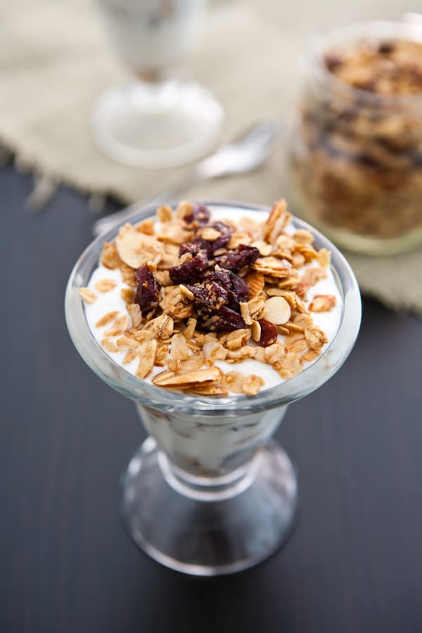 parfait filled with cranberries and almond black background