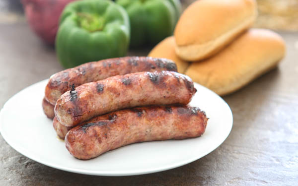 bratwurst with buns and vegetables