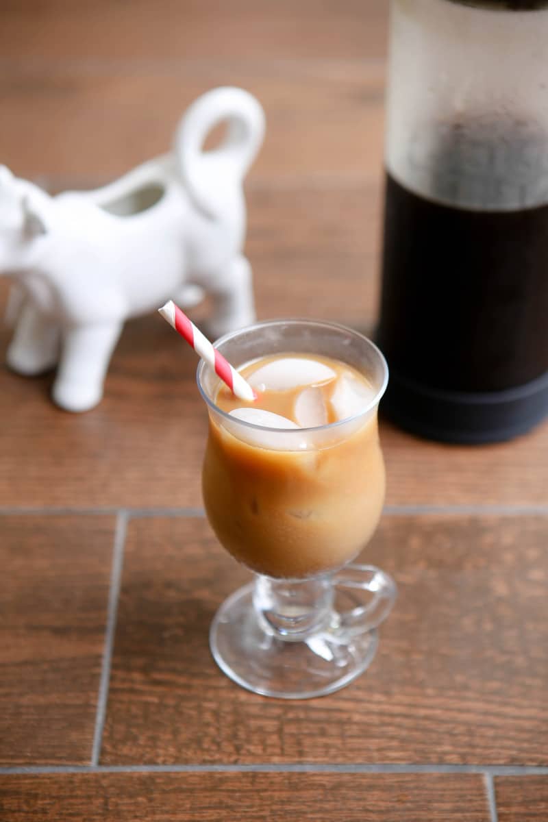 ice coffee in glass with creamer and coffee