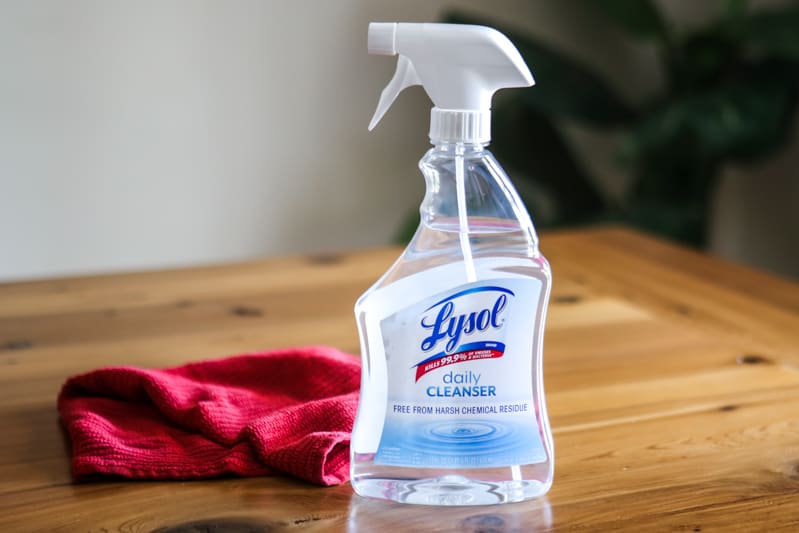 lysol spray with red rag