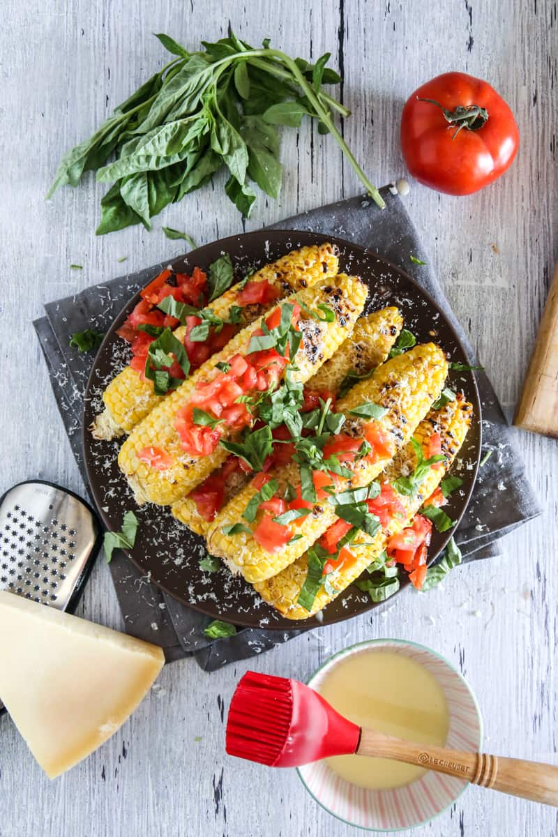 corn on the cob with parm and vegetables