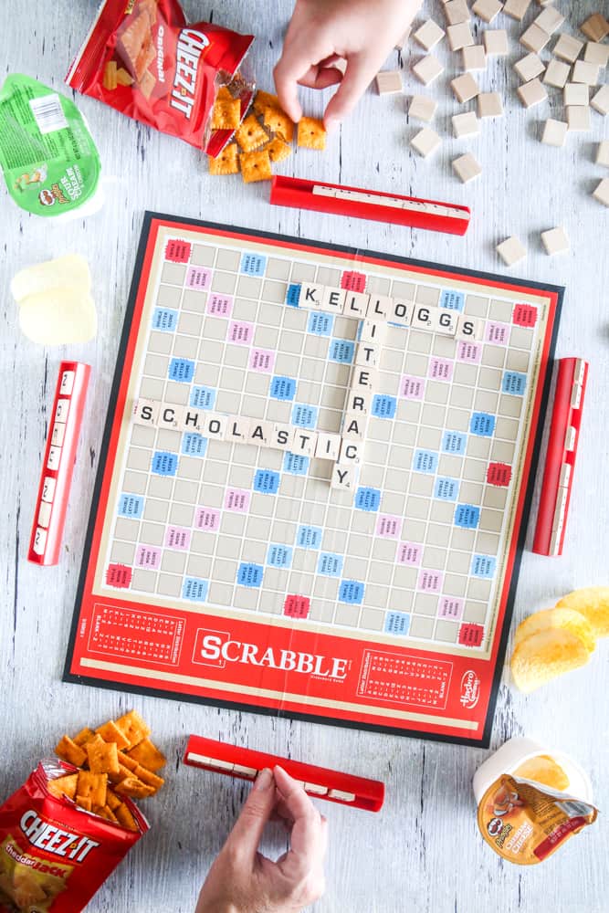 people eating snacks and playing scrabble