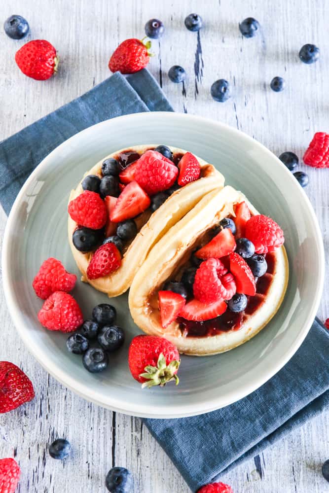 waffle tacos on green plate with berries