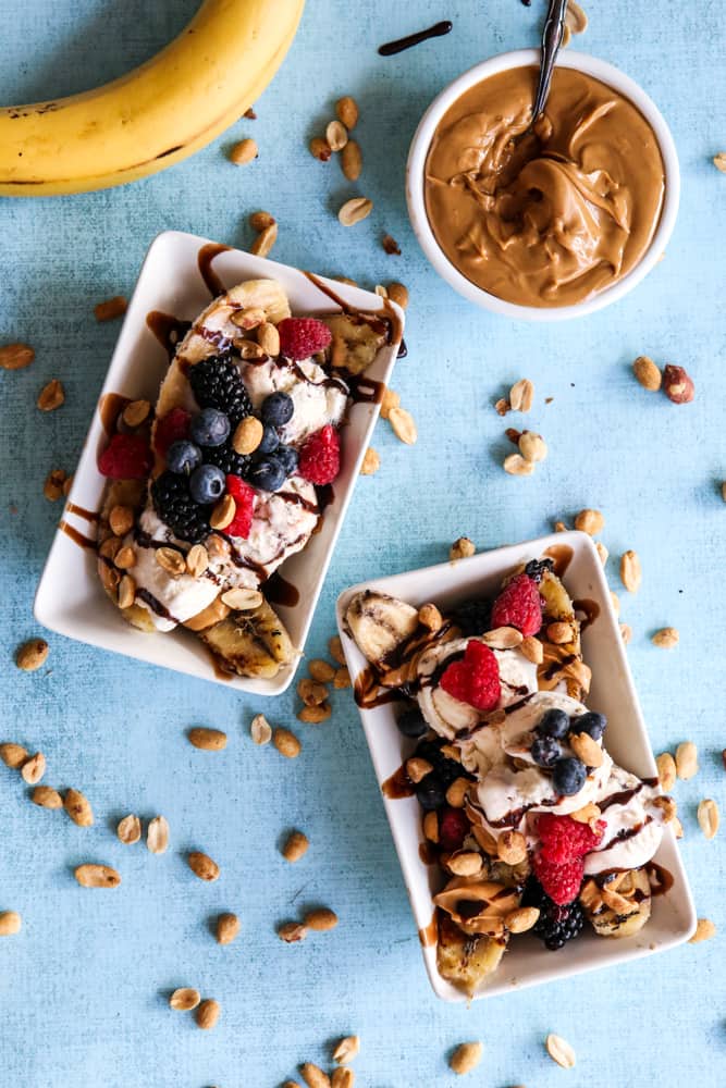 peanut butter banana split with banana and jar of peanut butter