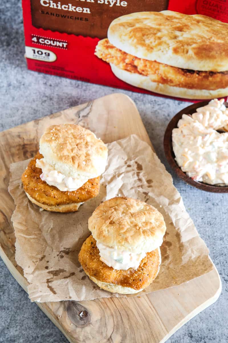 two chicken biscuits with bowl of pimento cheese