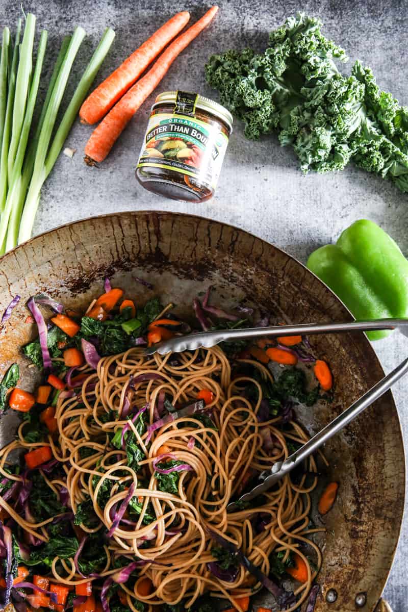 cooked noodles with vegetables inside wok