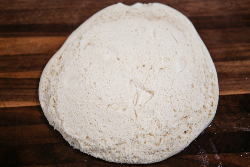 everything parker house roll dough on cutting board